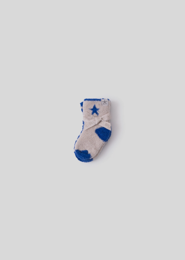 Baby socks pack that is white and blue tied together laying on a white background