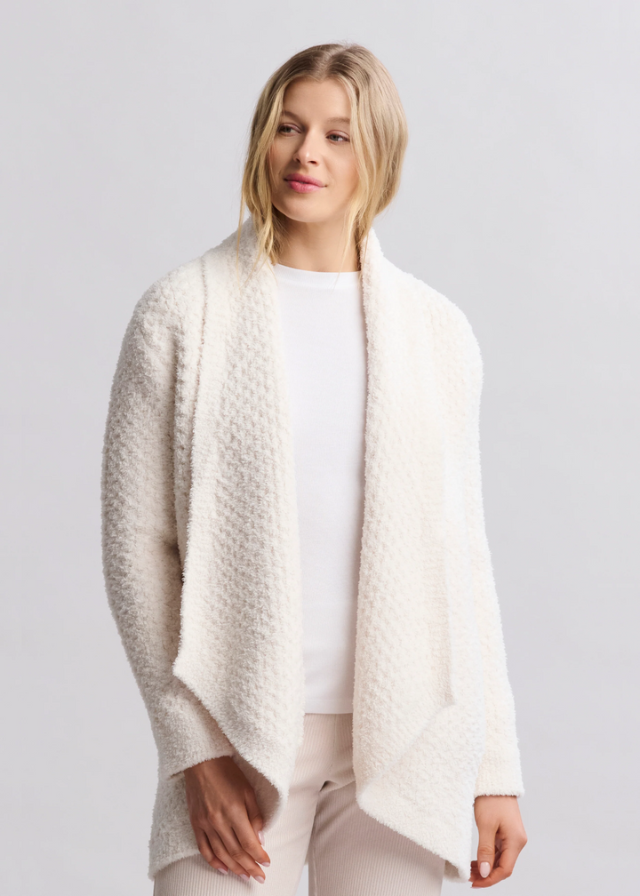 Woman wearing a cream textured cardigan