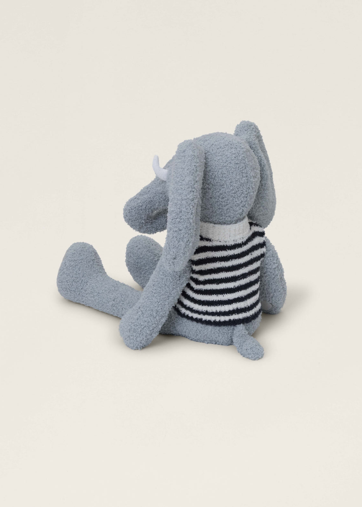 Grey mammoth stuffed animal wearing a black and white striped tee