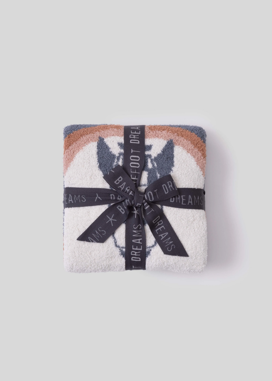 Folded blanket with a spaceship design with a charcoal grey bow on a white background