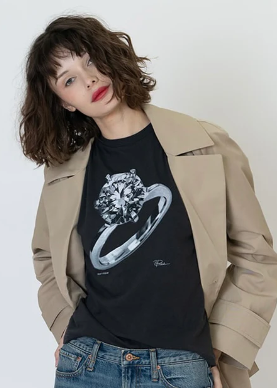 Woman wearing a black tee with an engagement ring graphic