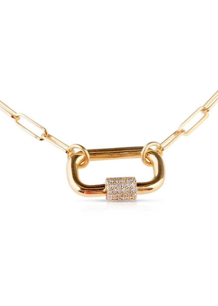 Close up of a gold chain necklace with a gold carabiner clasp on a white background