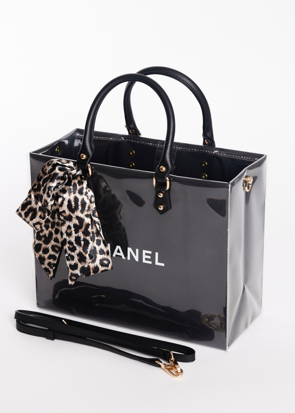 Clear coated black Chanel shopping bag with a leopard print scarf handle
