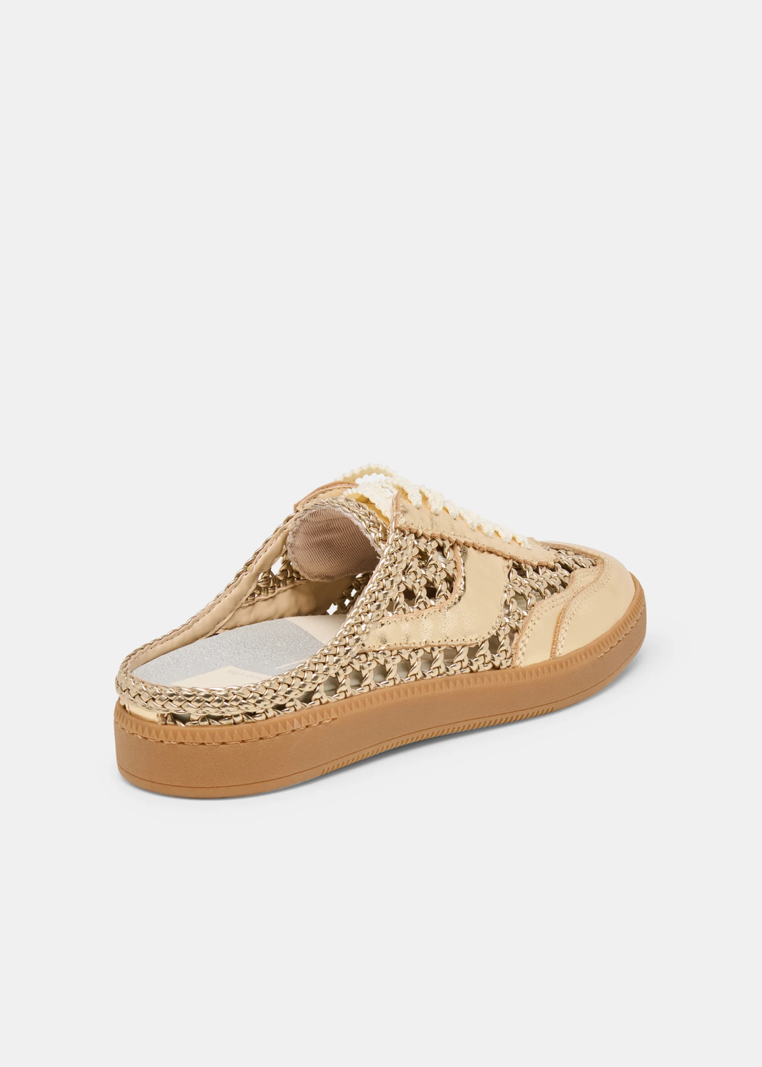 Gold woven slip on sneaker against a white background