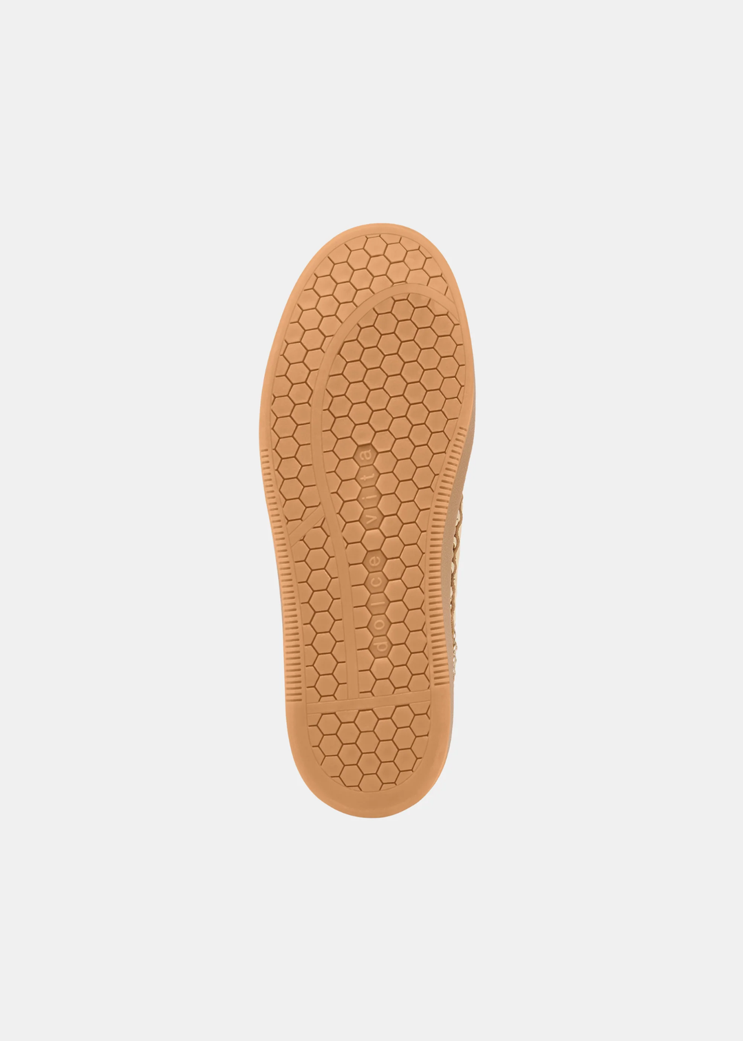 Shoe with a tan sole against a white background