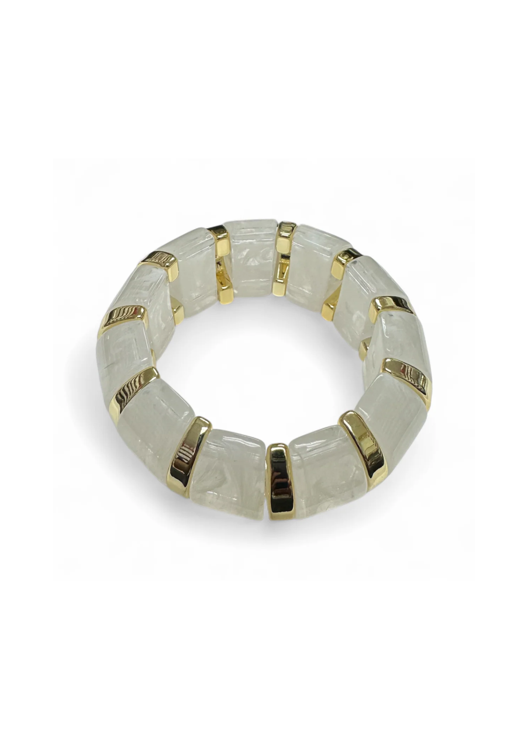 Clear white and gold beaded stretch bracelet on a white background