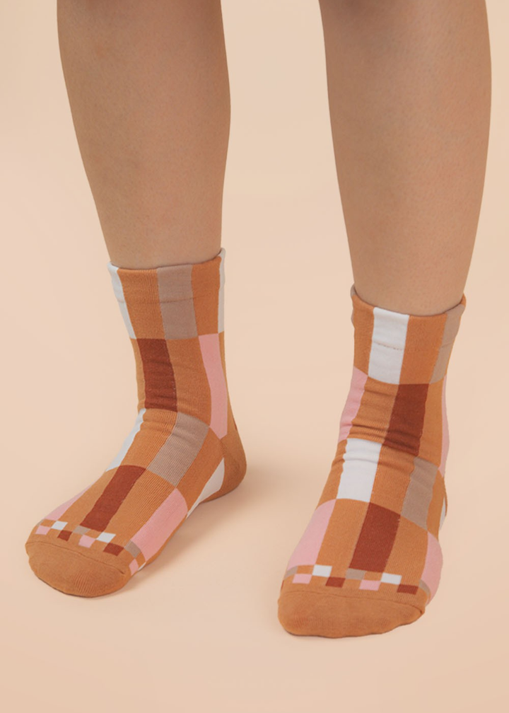 Person wearing brown colorblock socks
