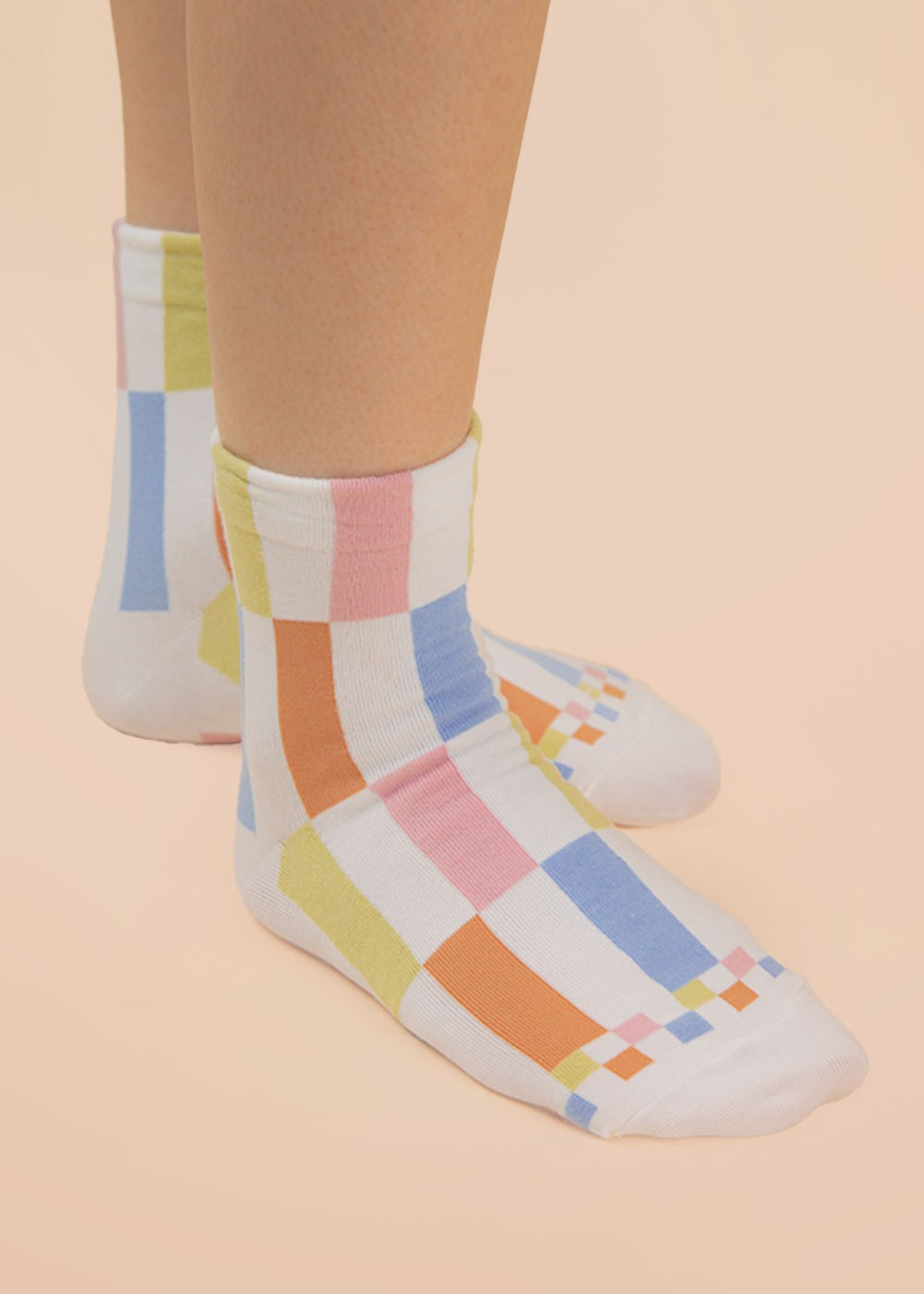 Person wearing multicolor colorblock crew socks