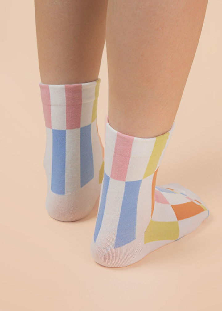 Person wearing multicolor colorblock crew socks
