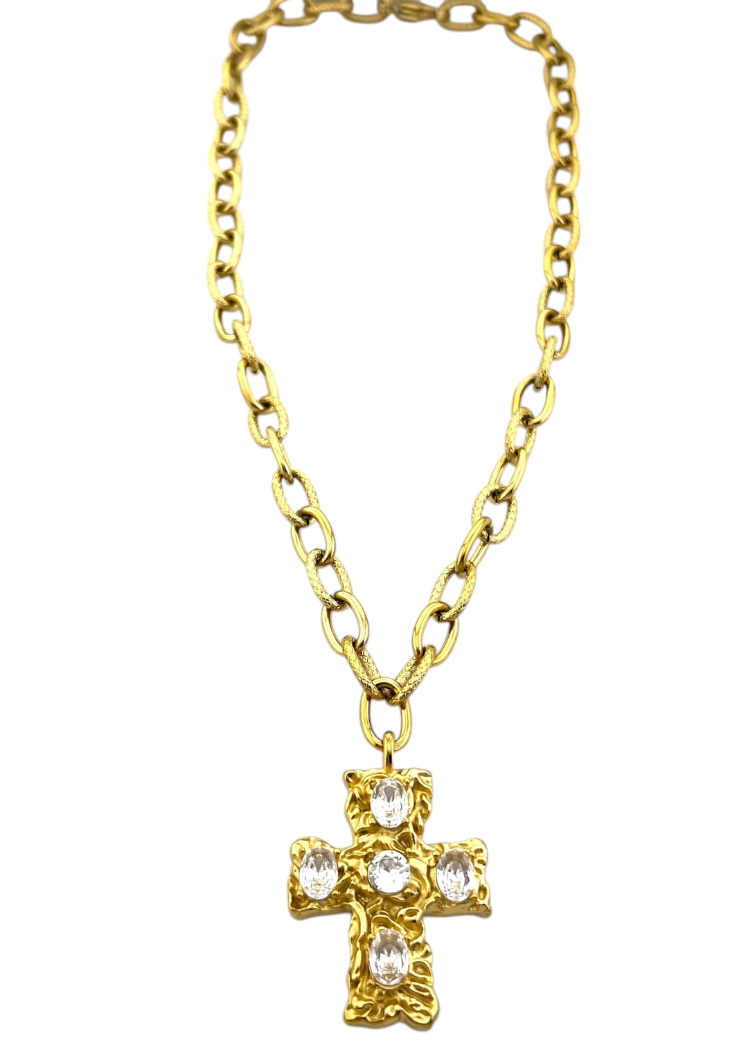 Gold chain necklace with a gold cross pendant with CZ studs on a white background
