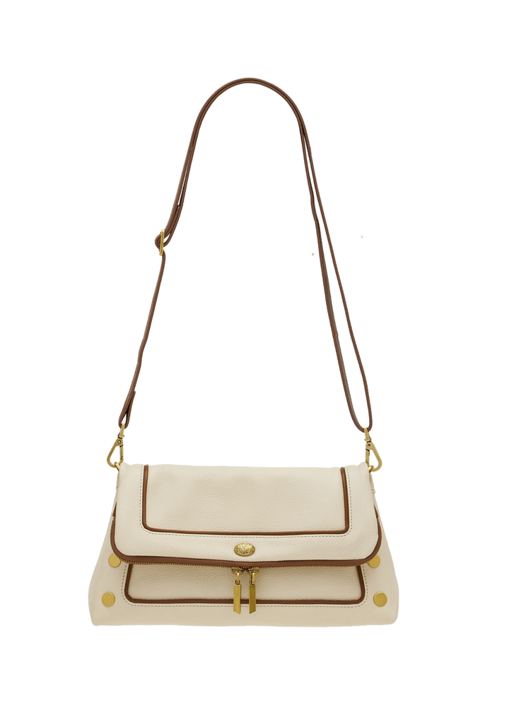 White leather purse with brown trim and gold accents