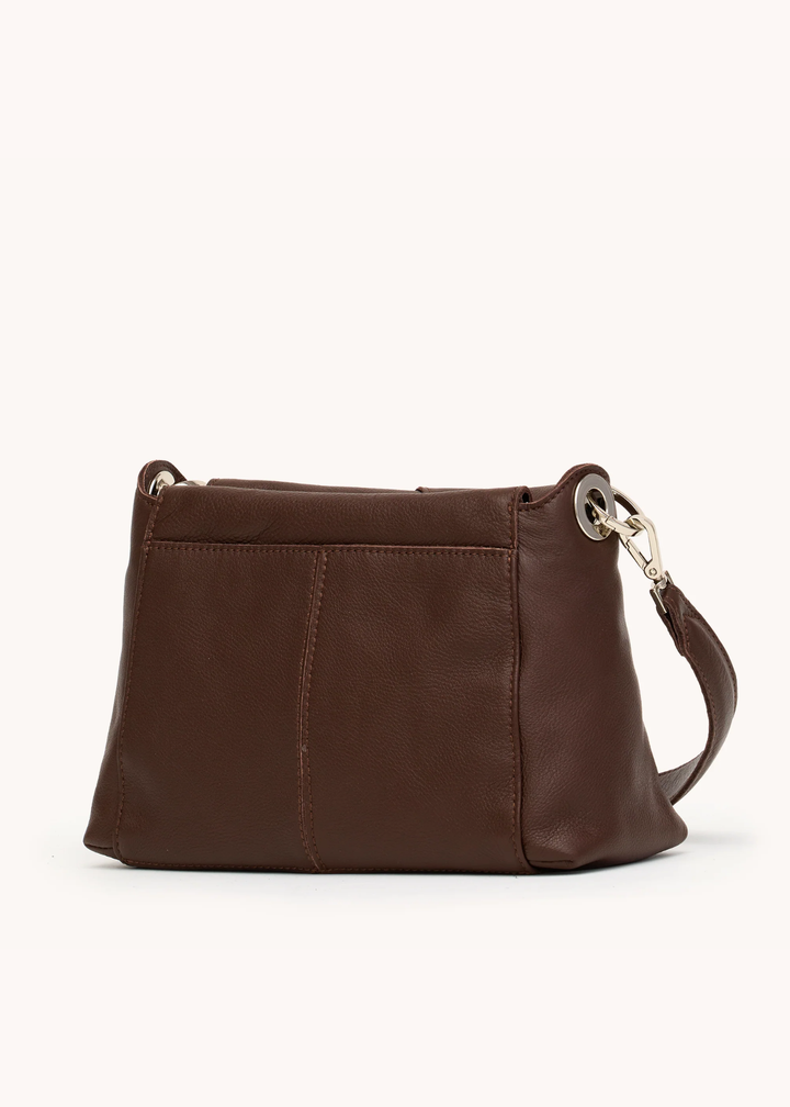 Brown leather woven purse with silver hardware on a white background