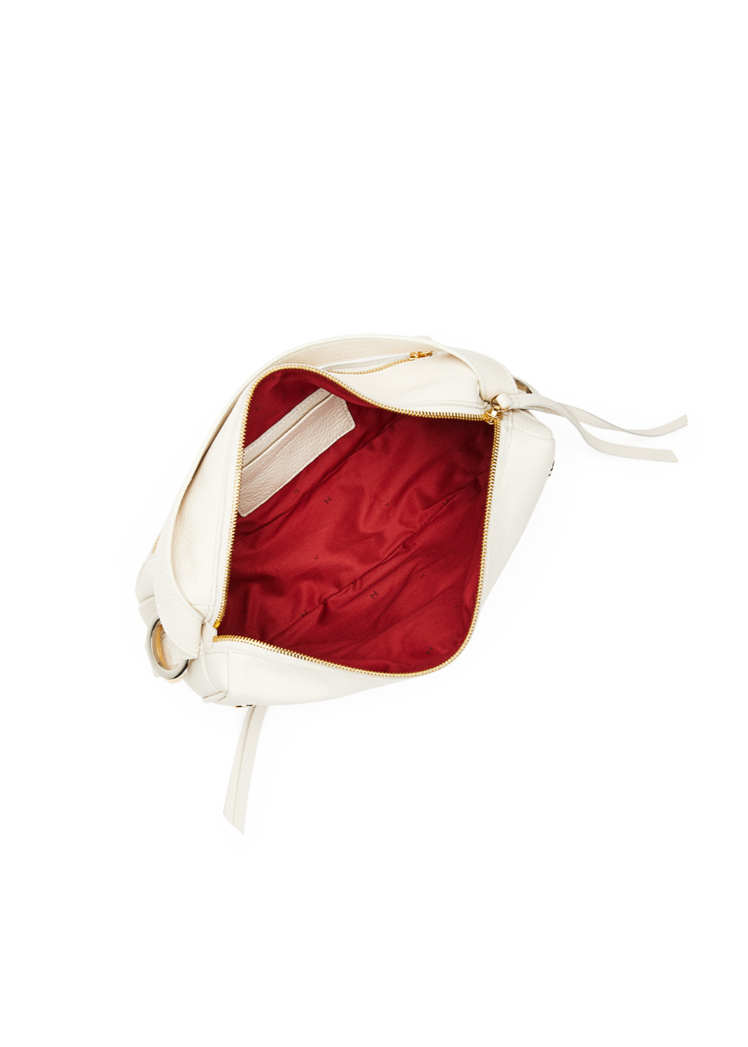 White leather purse with gold and silver hardware accents sitting open with red inner lining
