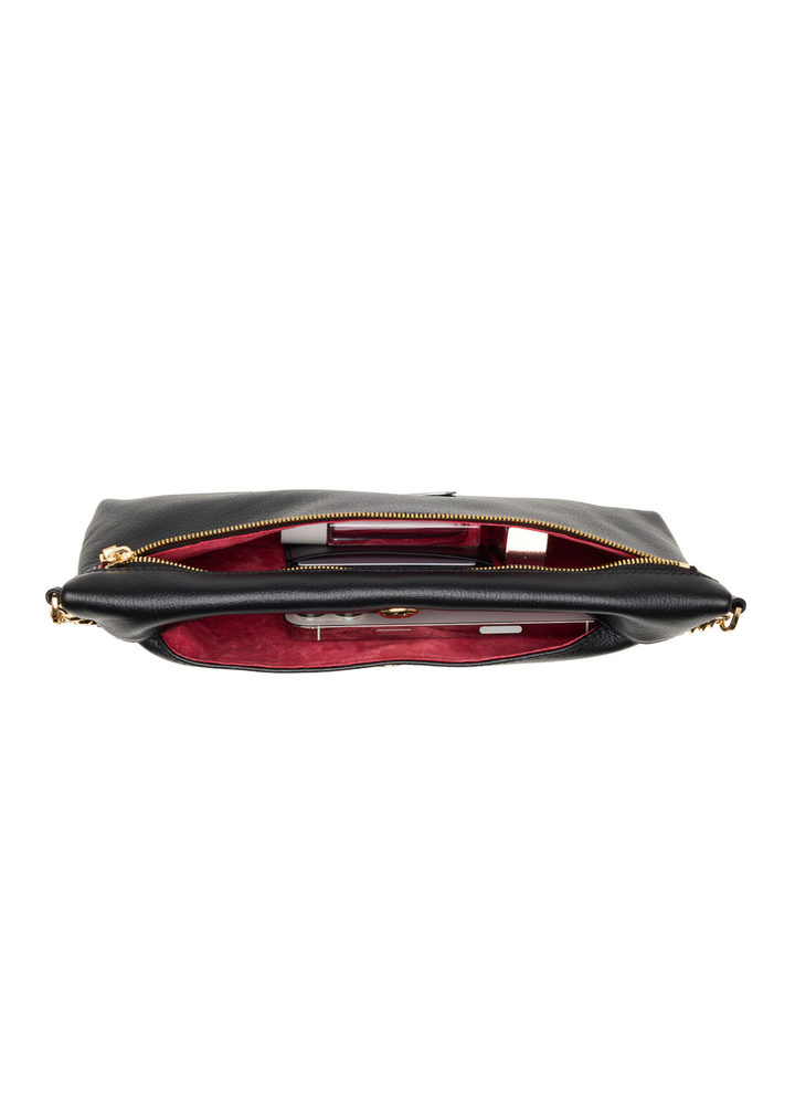Black leather clutch with a red interior sitting open on a white background