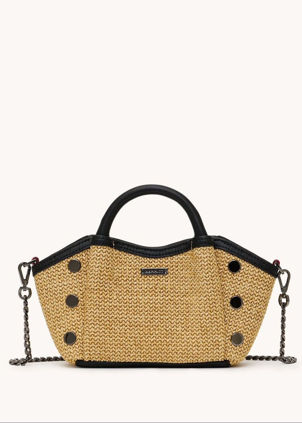 Woven handbag with black accents on a white background