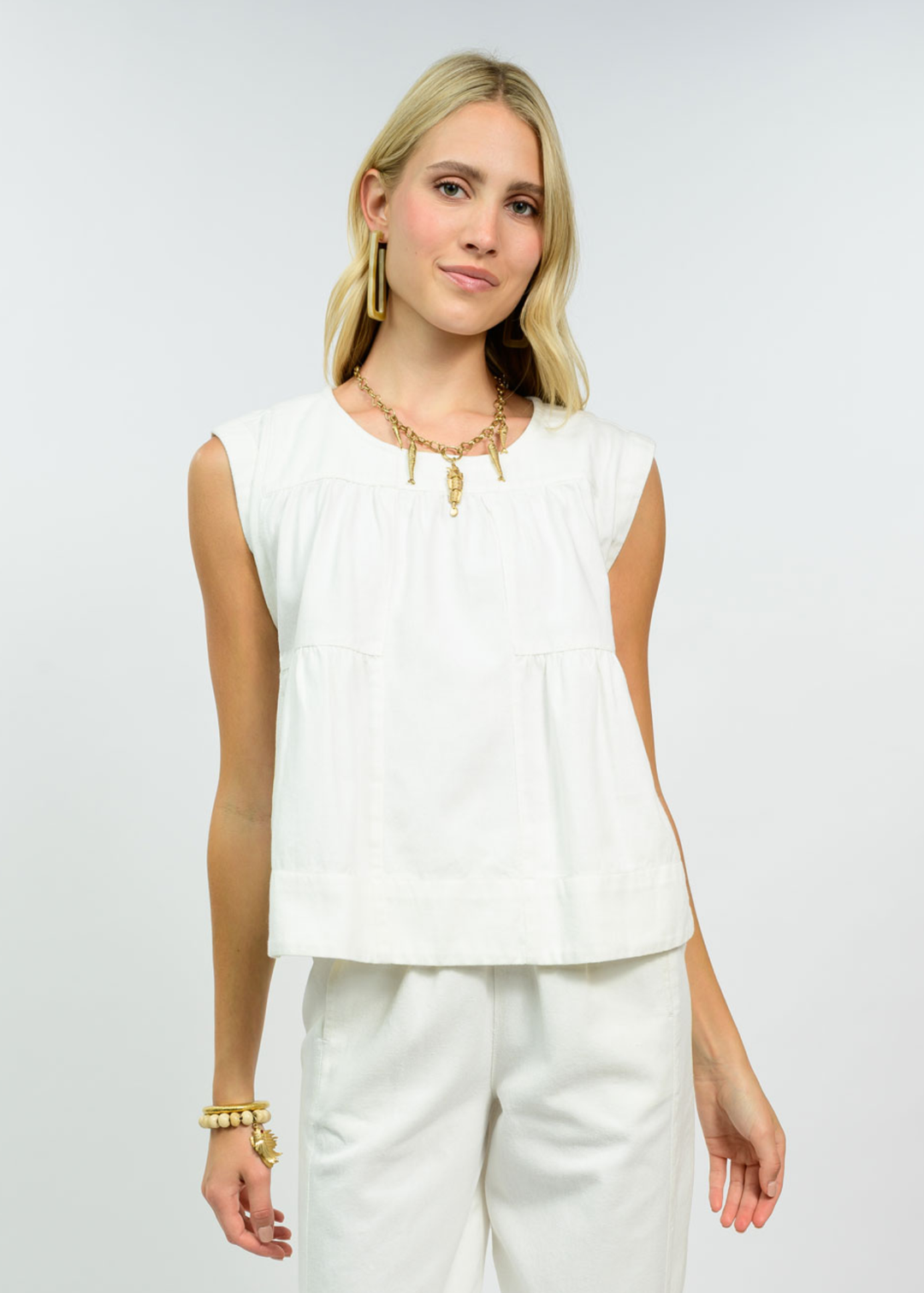 Woman wearing a white top with matching pants