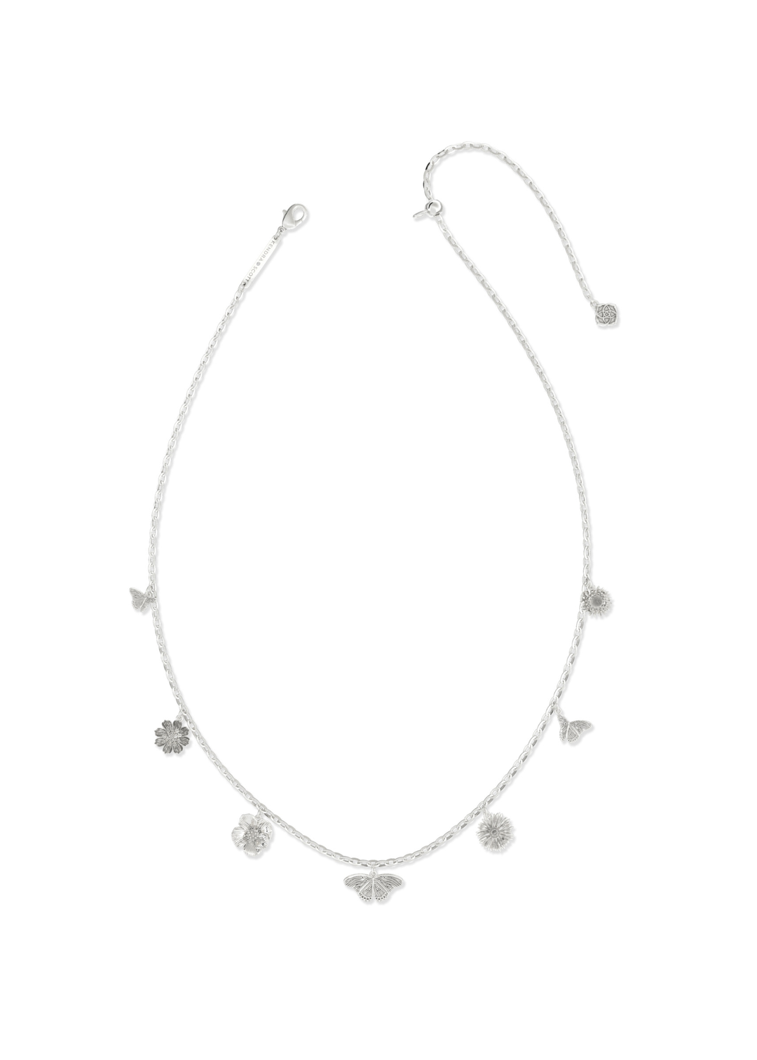 Vintage rhodium charm necklace on a white background