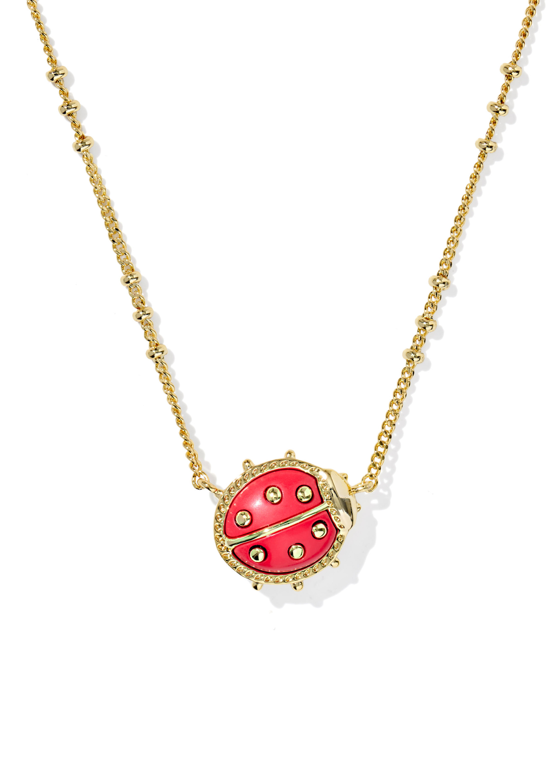 Gold necklace with a red ladybug pendant on a white background