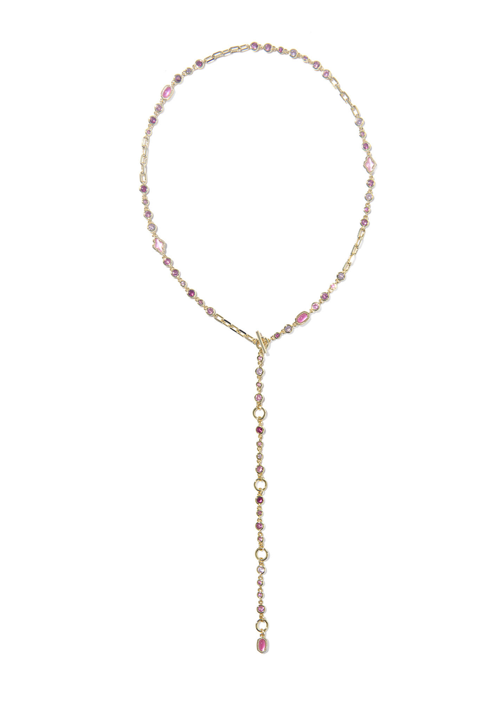 Gold necklace with pink stones against a white background