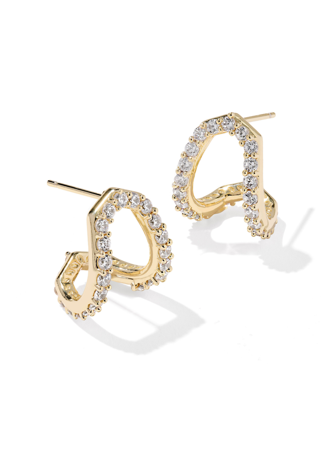 Gold framed huggie earrings with CZ studding on a white background