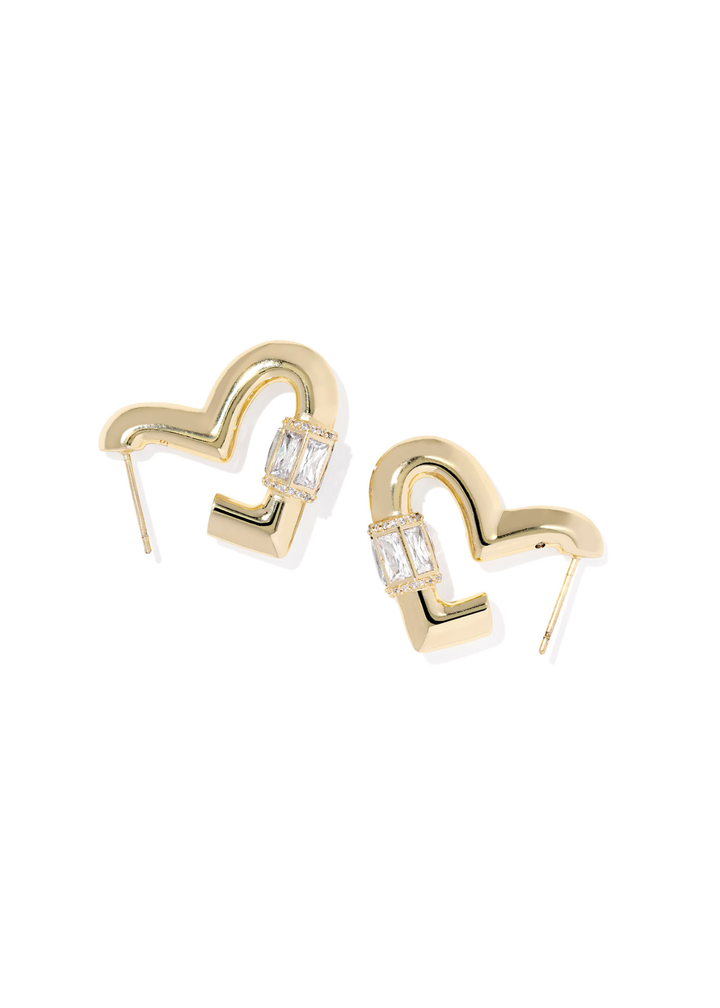 Gold heart shaped hoop earring with CZ details laying on a white background