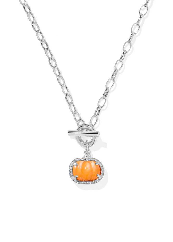 Rhodium link and chain necklace with an orange pumpkin shaped pendant framed in rhodium on a white background