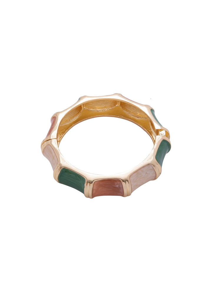 Gold, pink, green, and tan bangle bracelet on a white background
