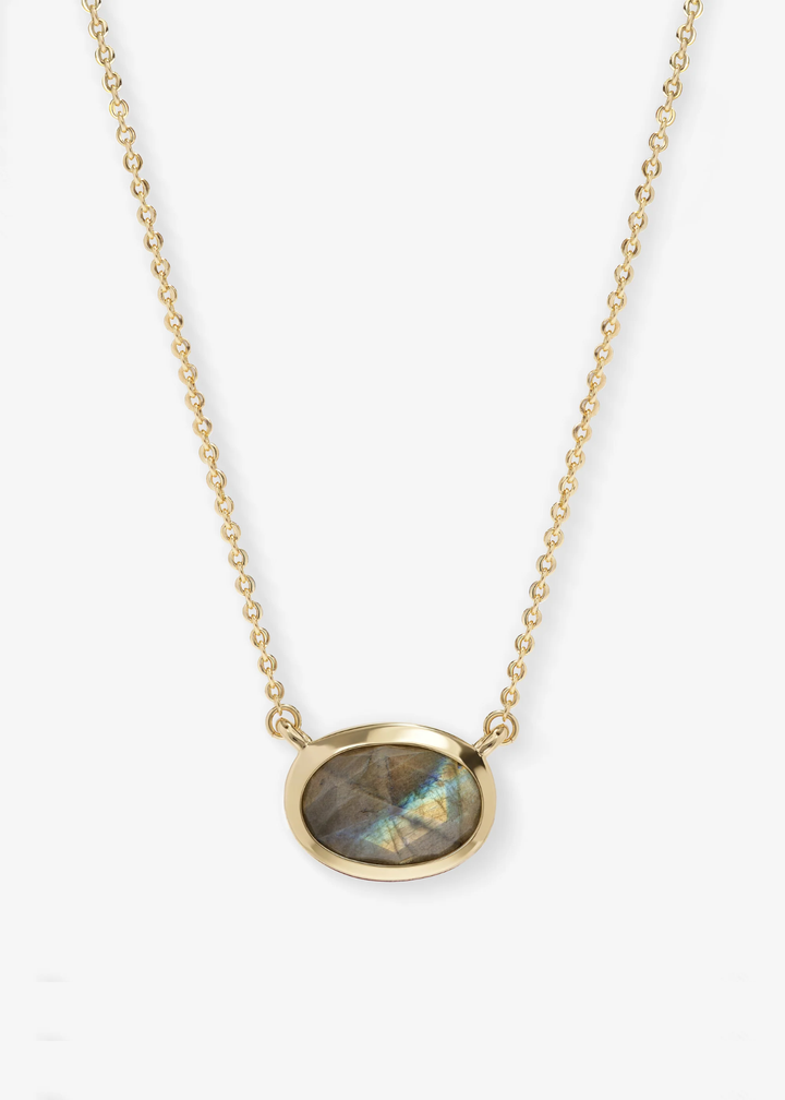 Gold framed labradorite pendant necklace on a white background