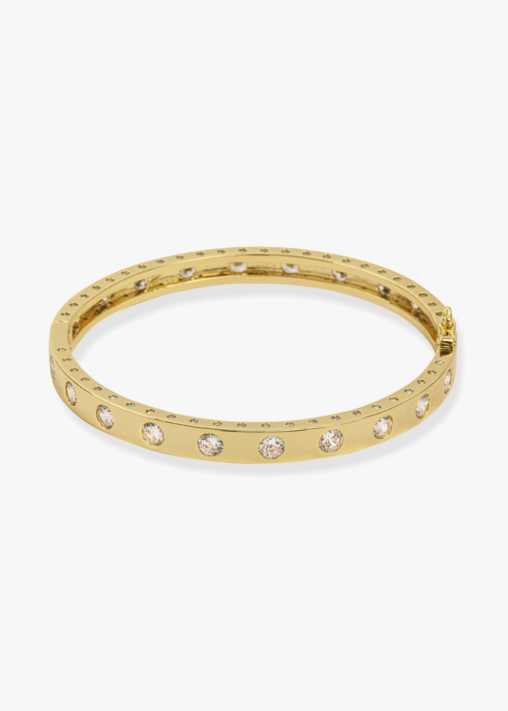 Gold cuff bracelet with CZ studding against a white background