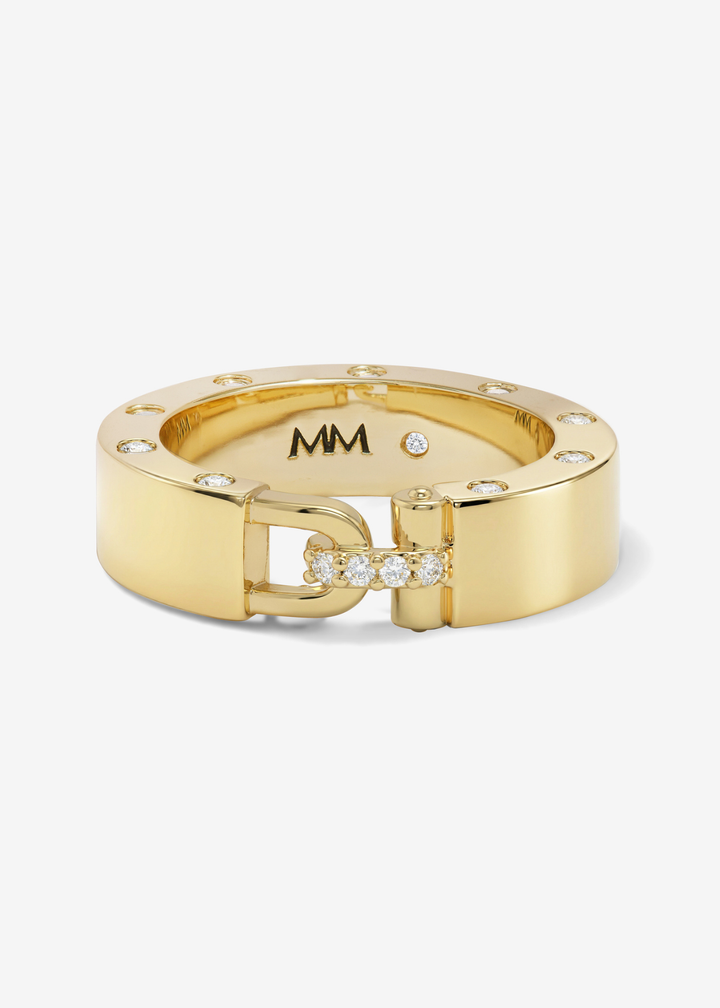 Gold band ring with CZ studding and a lock clasp on a white background