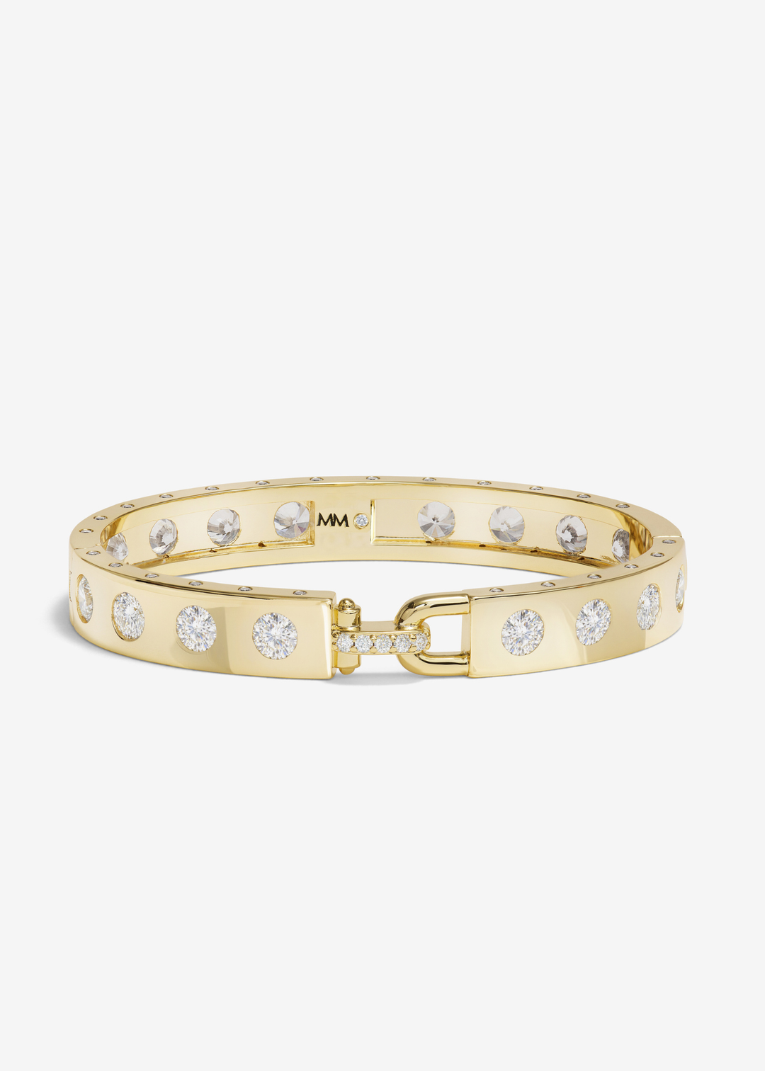 Gold cuff bracelet with CZ studding on a white background