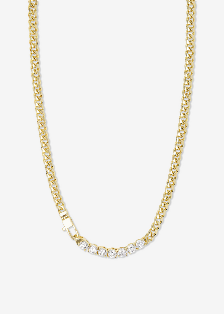 Gold chain necklace with round simulated diamonds on a white background