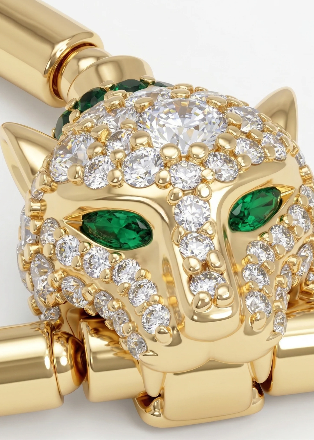 Close up of a gold lariat necklace with a jaguar head clasp