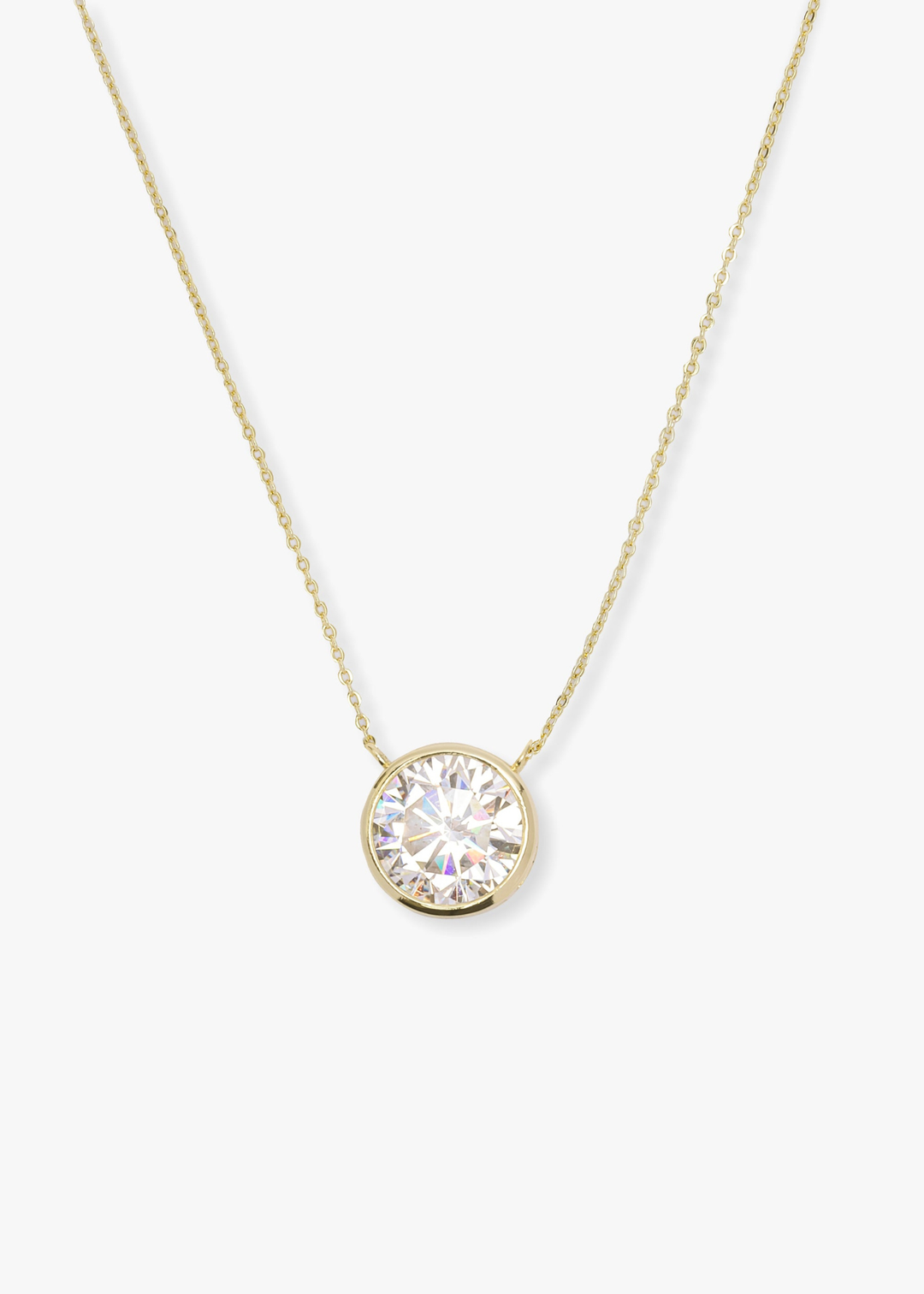 Gold necklace with a round simulated diamond pendant on a white background