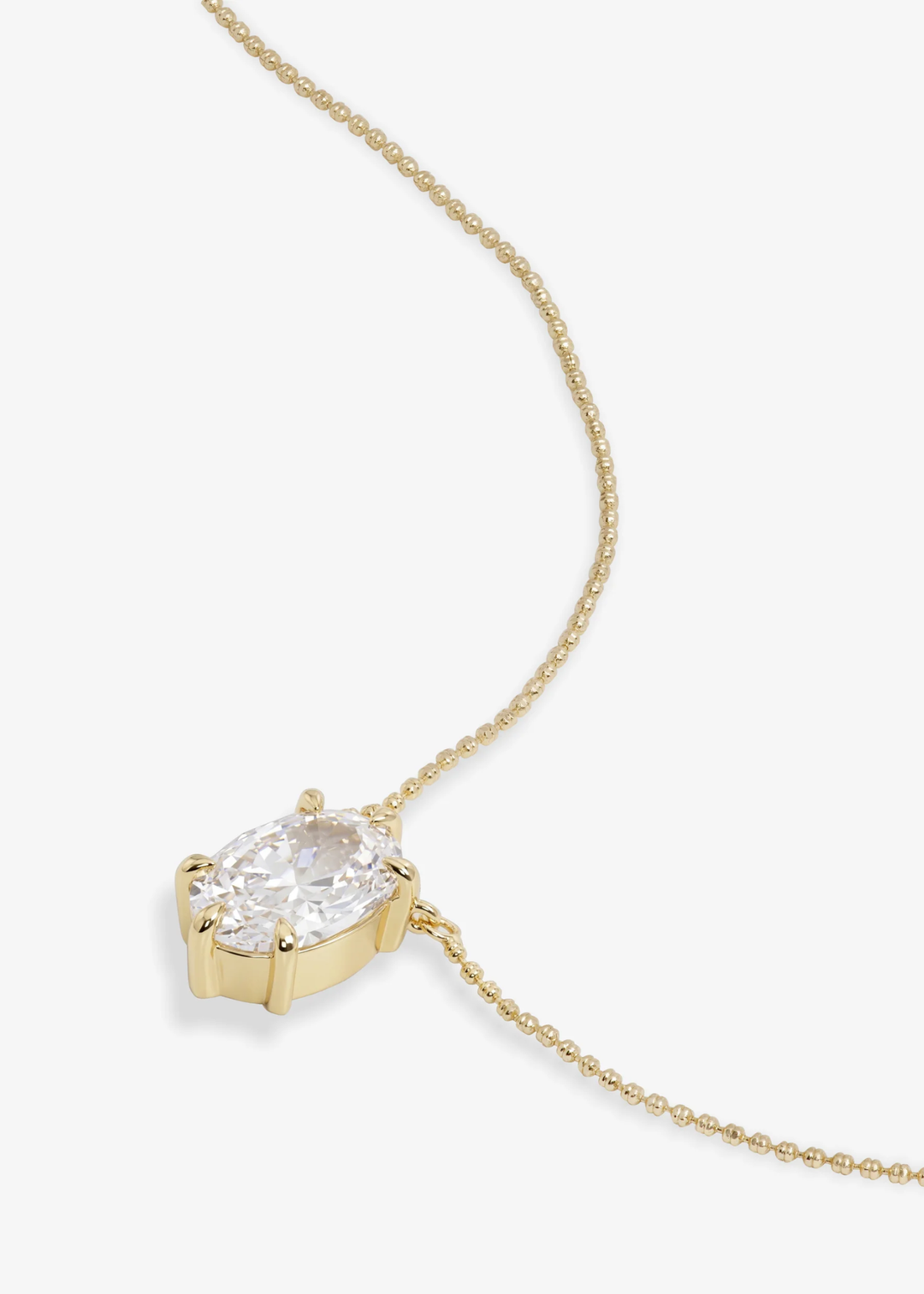Gold simulated diamond pendant neckline on a white background
