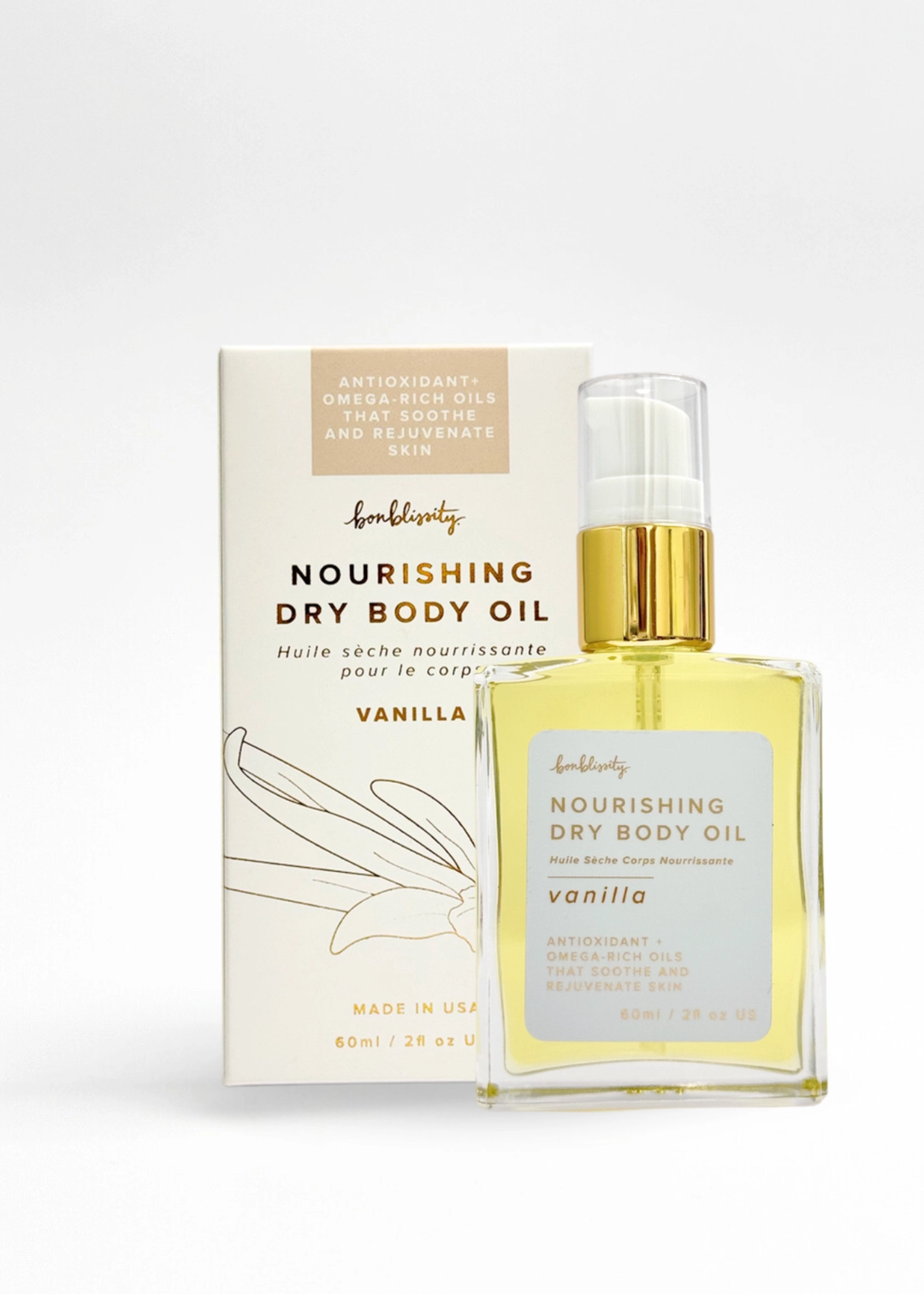 Vanilla scented nourishing dry body oil bottle next to packaging