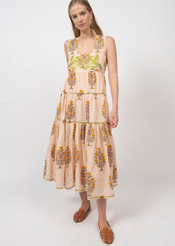 light peach pink dress with orange and brown floral print and green chest embroidery featuring thick straps and tiered midi skirt
