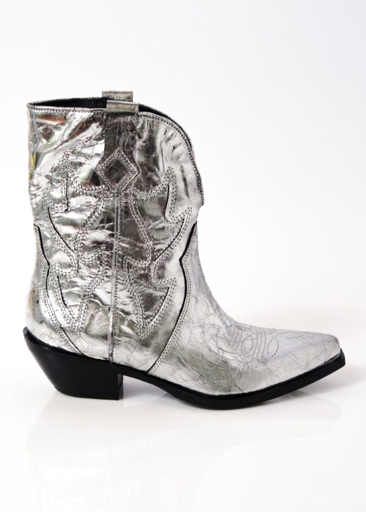 metallic silver cowboy booties with black heeled sole