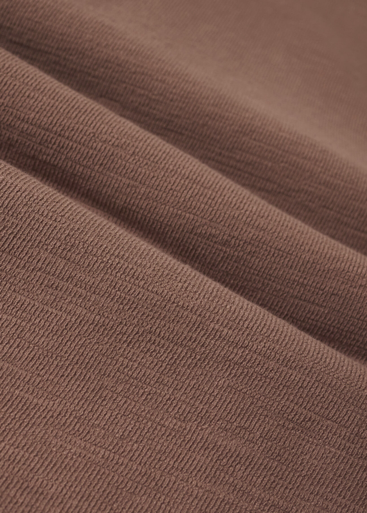 Close up of brown knit fabric