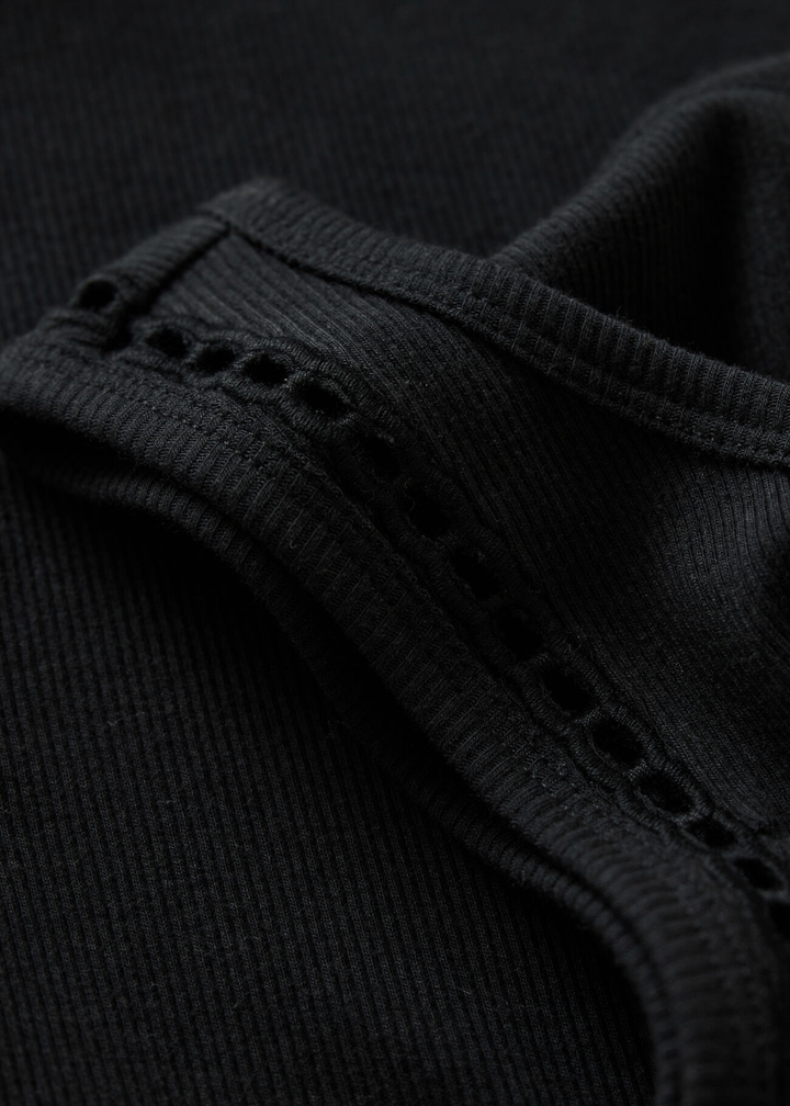 Close up of a black tank top