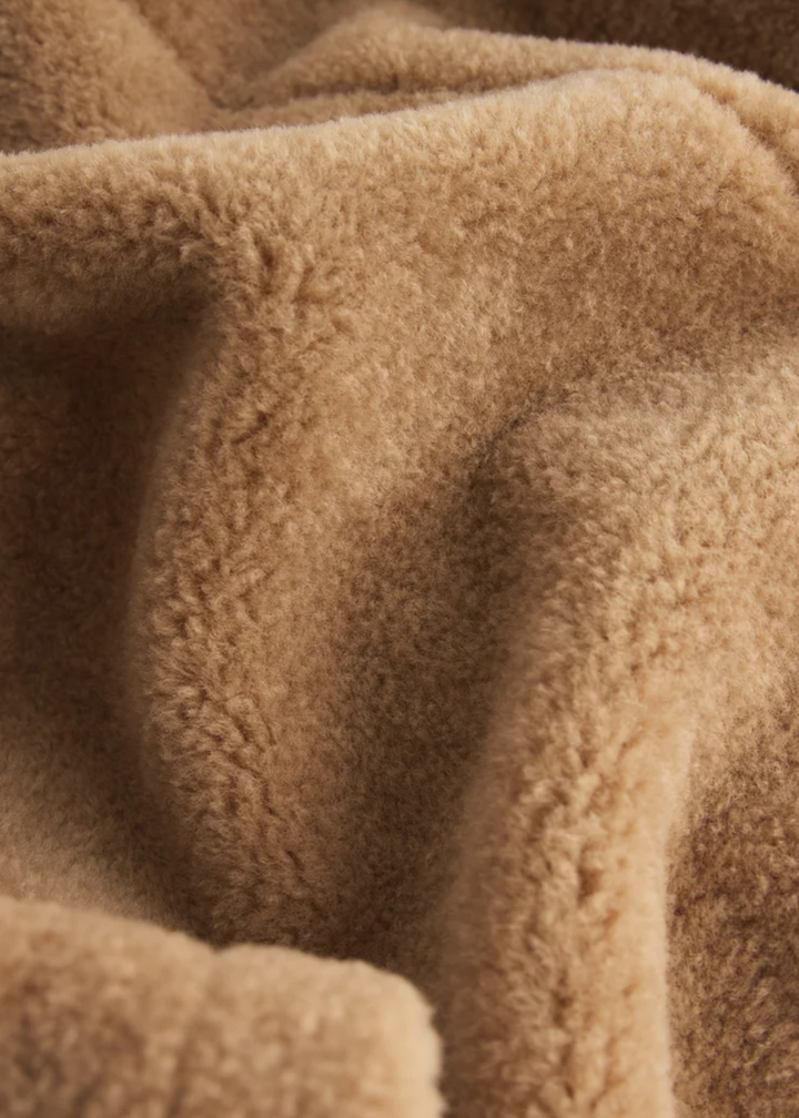 Close up of the brown sherpa material of the jacket