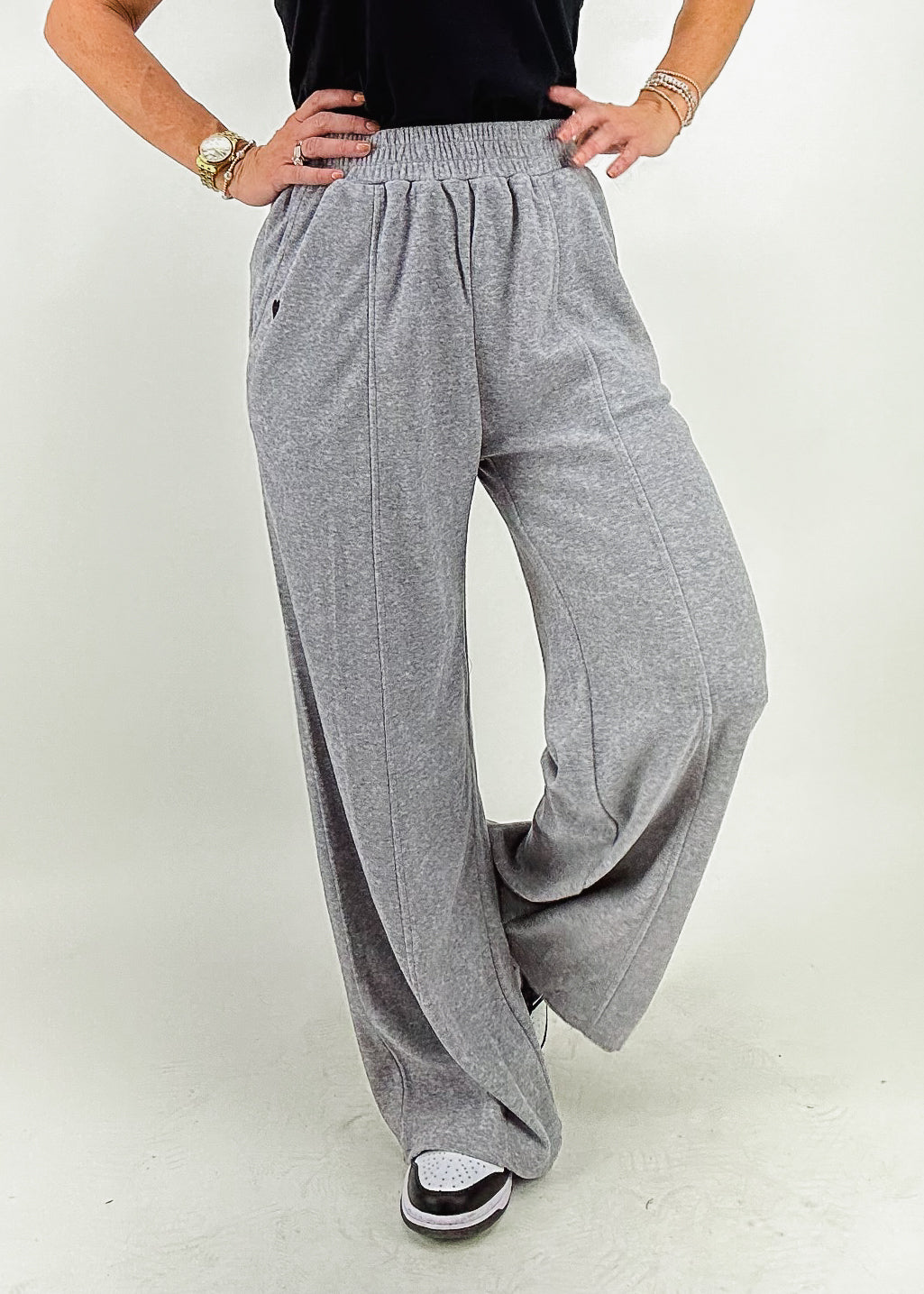 heather grey wide leg elastic waistband sweatpants with black embroidered heart on hip