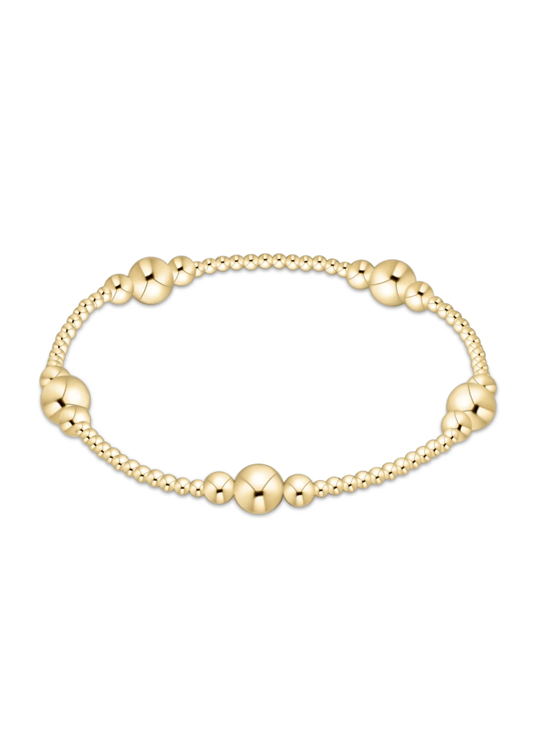 Gold beaded bracelet on a white background