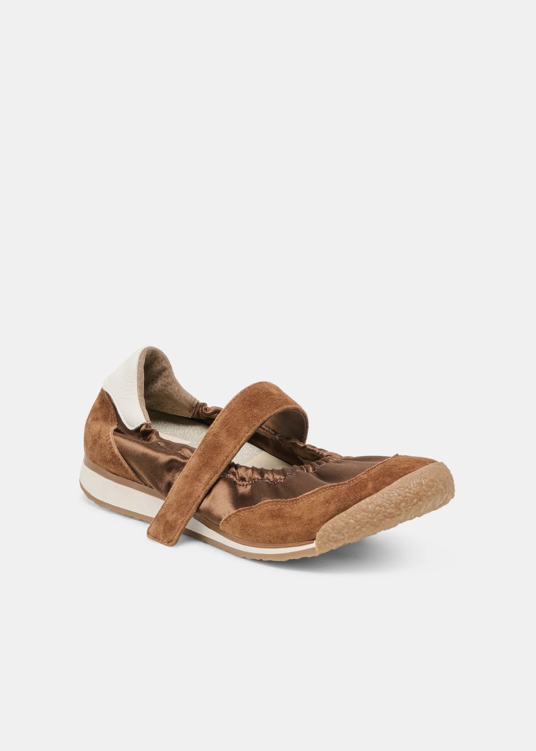 Brown sneaker/flat on a while background turned towards the side. 