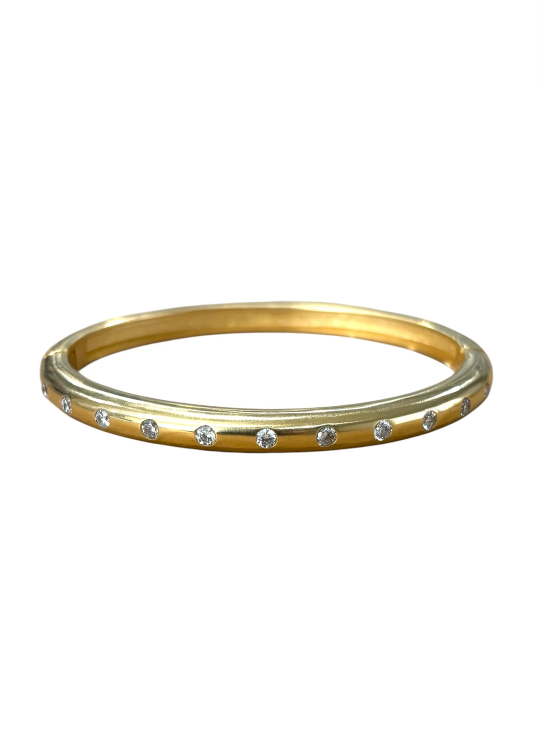 A thin yellow gold bangle bracelet with a row of small clear stones set along the front edge, shown against a plain white background.