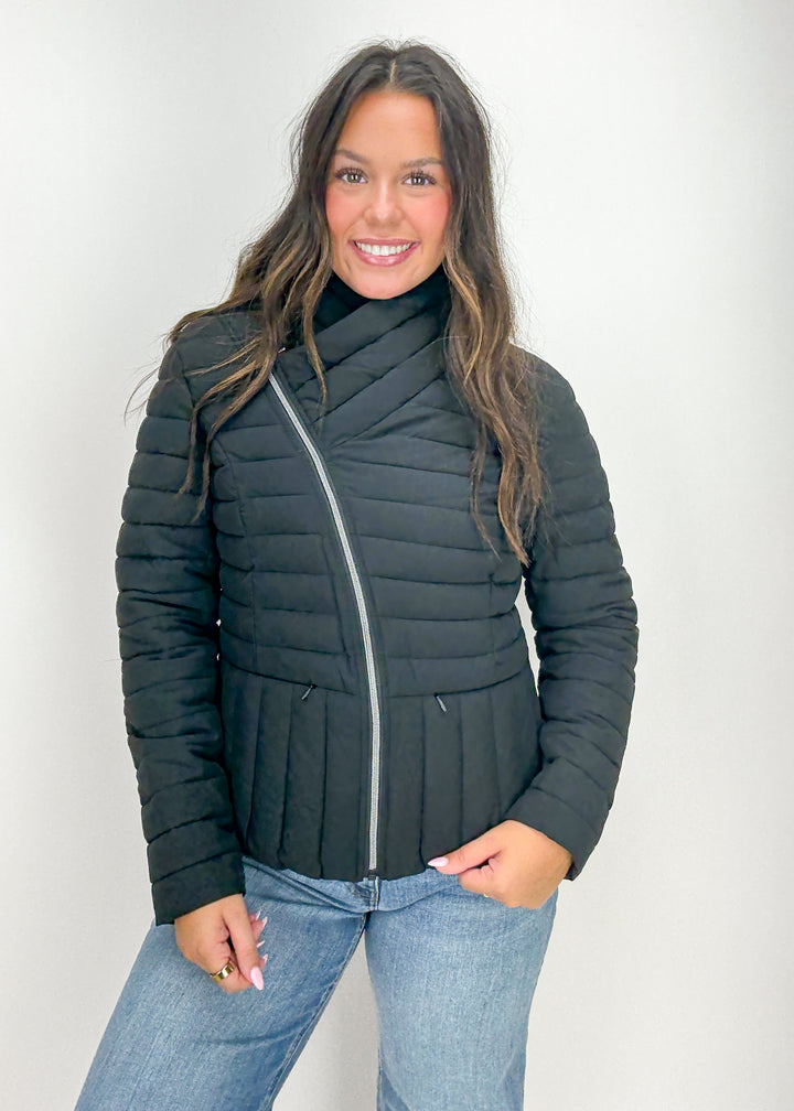 Woman wearing a black puffer jacket 