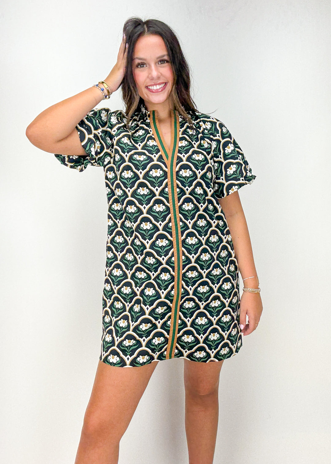 Woman wearing a black floral mini dress