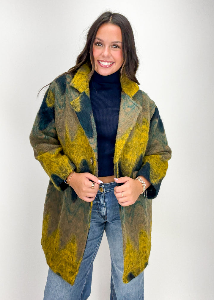 Woman wearing a patterned coat 