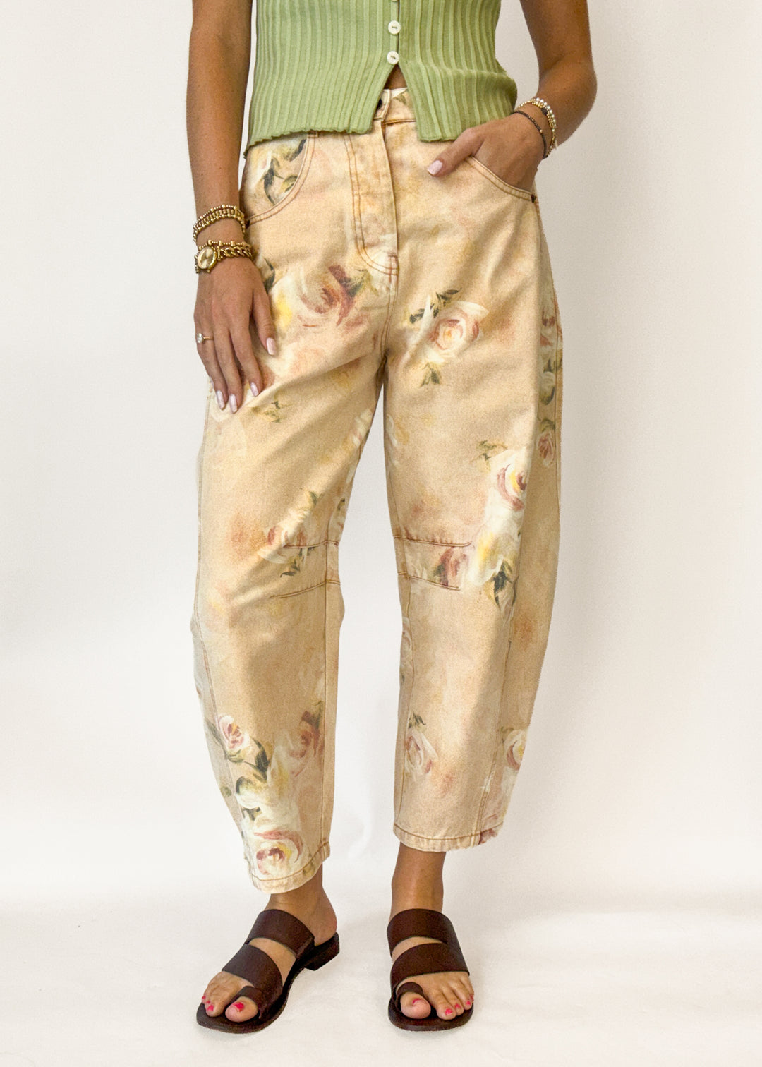 Woman wearing a vintage rose pattern barrel pants