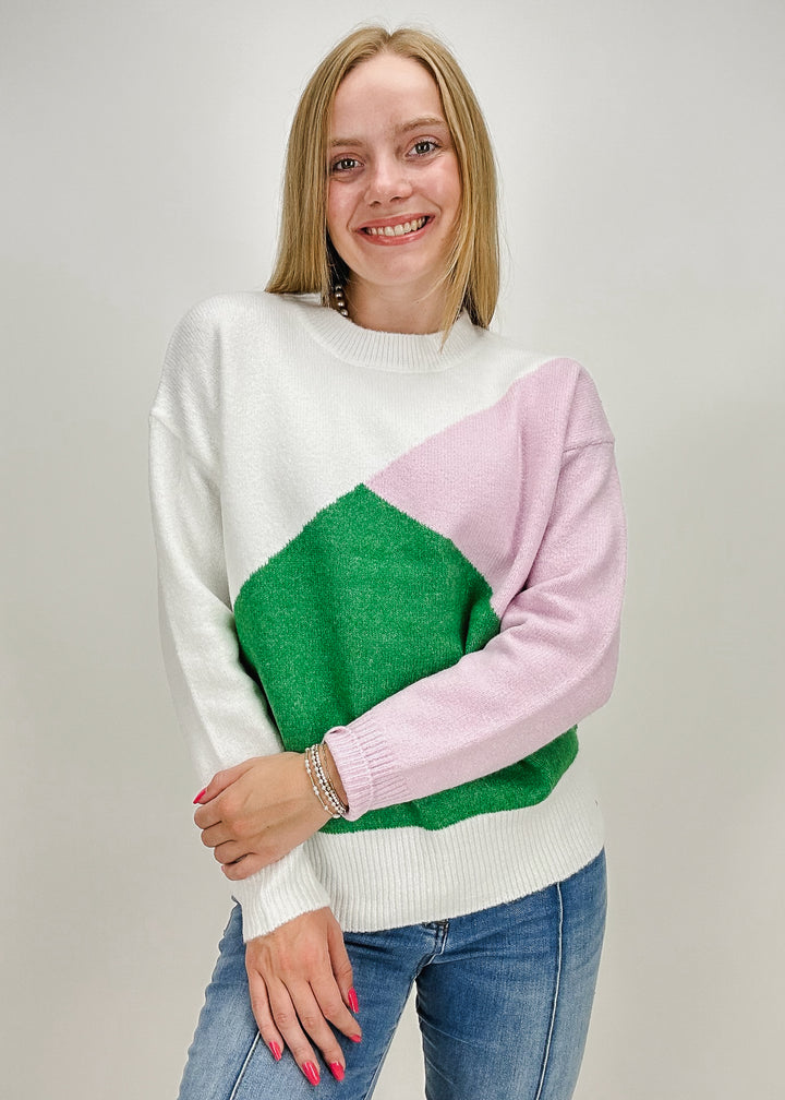 pink, green, and white ribbed collar, hem, and cuff abstract sweater